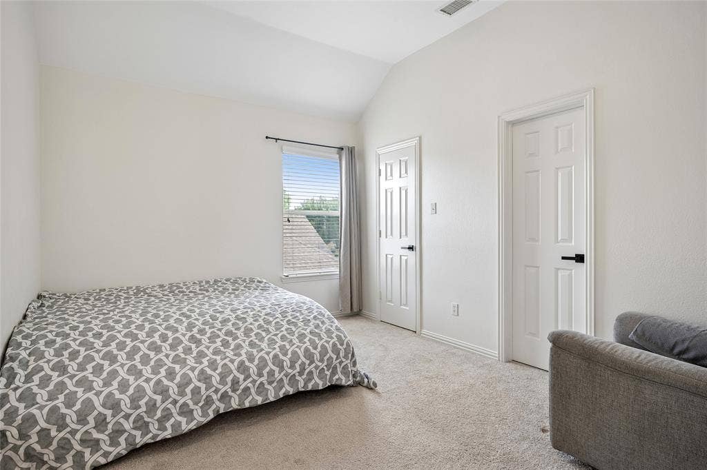 3801 Kite Meadow Drive, Plano, TX 75074 Vaulted ceiling, white walls, two paneled interior doors, and carpet flooring