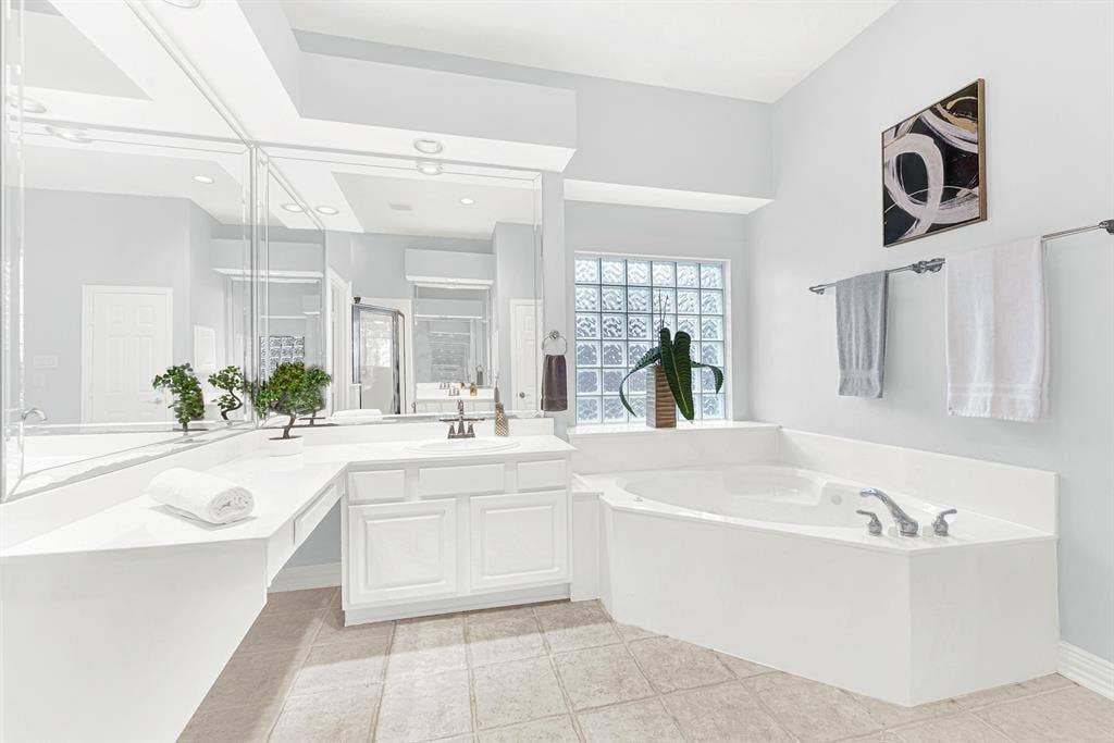 4433 Creekbend Circle, Richardson, TX 75082 Primary bathroom features separate tub and shower