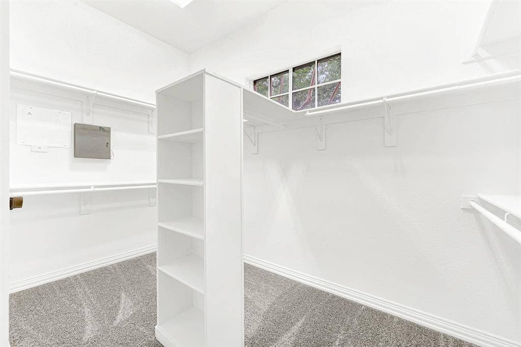 4433 Creekbend Circle, Richardson, TX 75082 Primary closet with extra shelving and storage