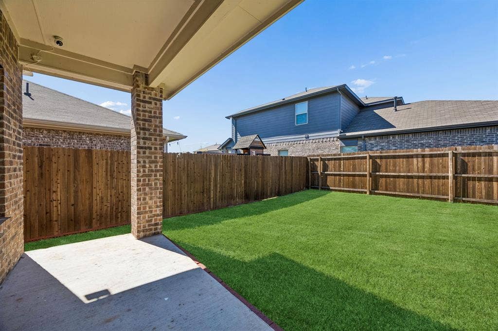 3719 Mildren Bend, Crandall, TX 75114 Looking into the back yard from the covered patio