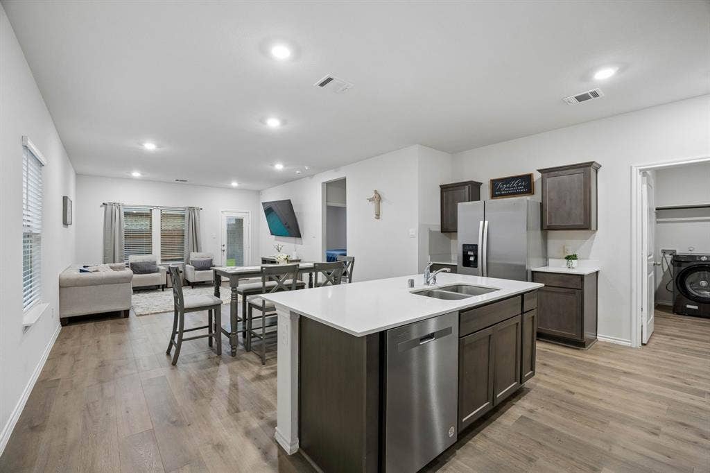 3719 Mildren Bend, Crandall, TX 75114 Here you can see the open concept layout with the kitchen, dining room and living.