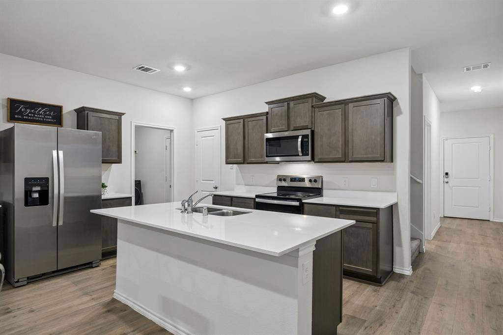 3719 Mildren Bend, Crandall, TX 75114 Here you can see the laundry room on the left and the pantry on the right.