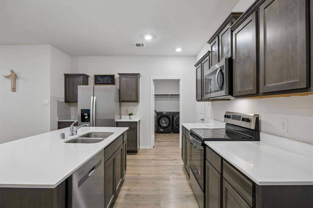 3719 Mildren Bend, Crandall, TX 75114 Kitchen featuring stainless steel appliances and recessed lighting