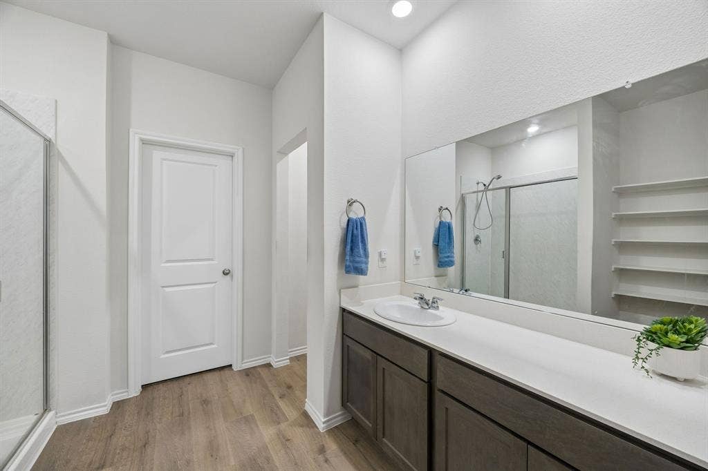 3719 Mildren Bend, Crandall, TX 75114 The ensuite primary bathroom features an oversized vanity.