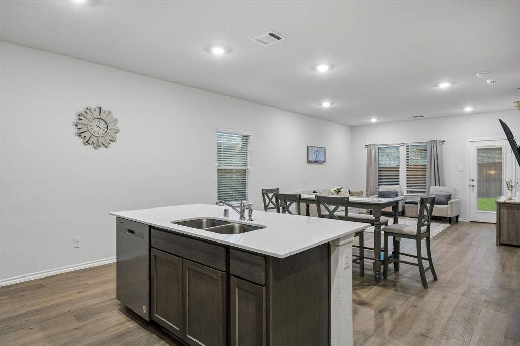 3719 Mildren Bend, Crandall, TX 75114 From the back of the kitchen looking into the open concept living space.