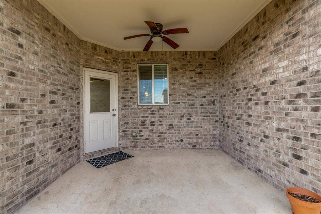 Covered patio with ceiling fan for outdoor living enjoyment