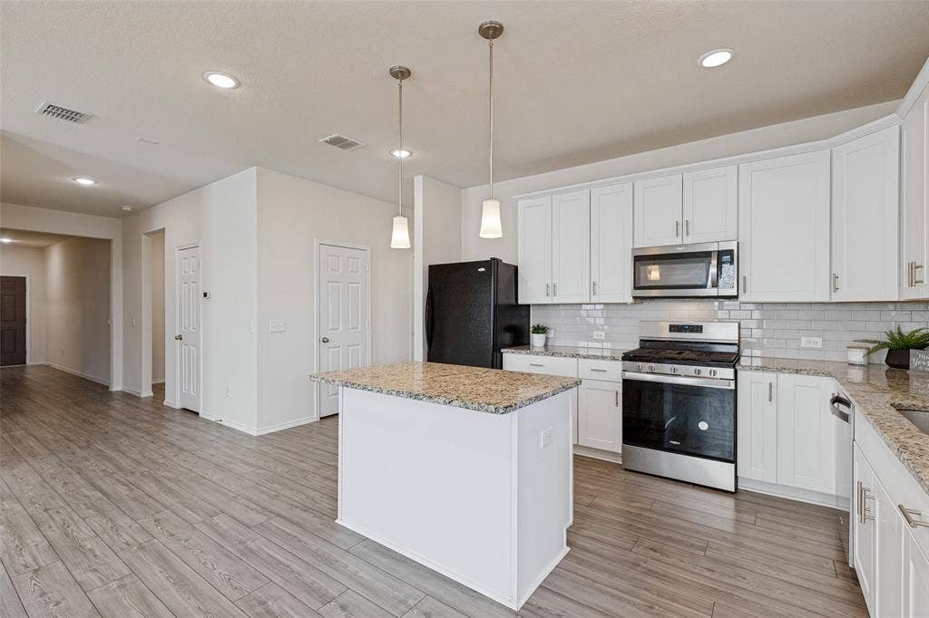 Notice the wide hallway which gives this home a very open feeling