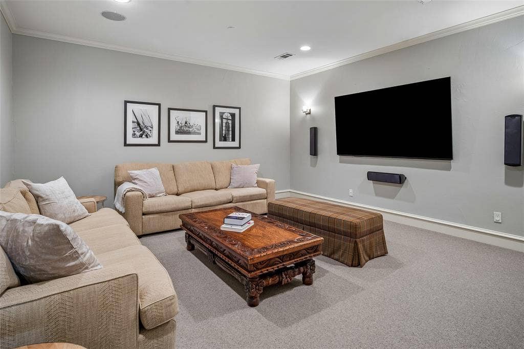 5222 Stonegate Road, Dallas, TX 75209 85" wall-mounted TV display, wall-mounted speakers.