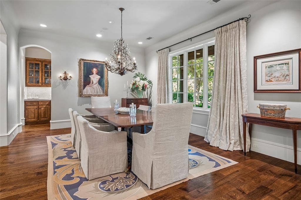 5222 Stonegate Road, Dallas, TX 75209 Hardwood flooring throughout, with a crystal chandelier and recessed lighting