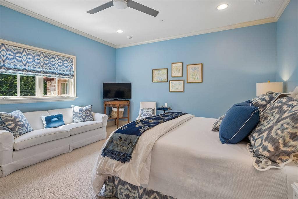 5222 Stonegate Road, Dallas, TX 75209 Bedroom suite #6 Recessed lighting, crown molding, ceiling fan, window with patterned shade, and wall-mounted sconce
