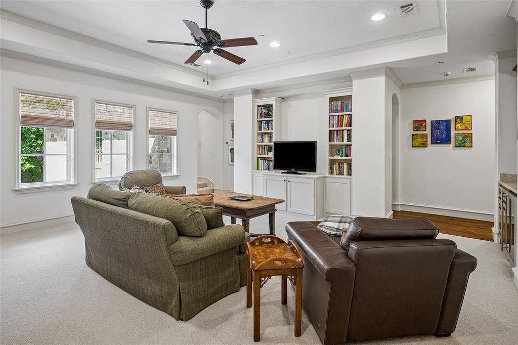 5222 Stonegate Road, Dallas, TX 75209 Second floor living area featuring a tray ceiling, recessed lighting, ceiling fan, built-in shelving, and multiple windows