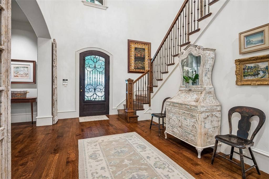 5222 Stonegate Road, Dallas, TX 75209 Arch top entry door with ornate wrought iron detailing