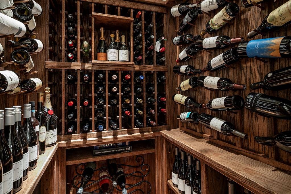 5222 Stonegate Road, Dallas, TX 75209 Built-in wood wine storage with individual bottle slots and horizontal displays