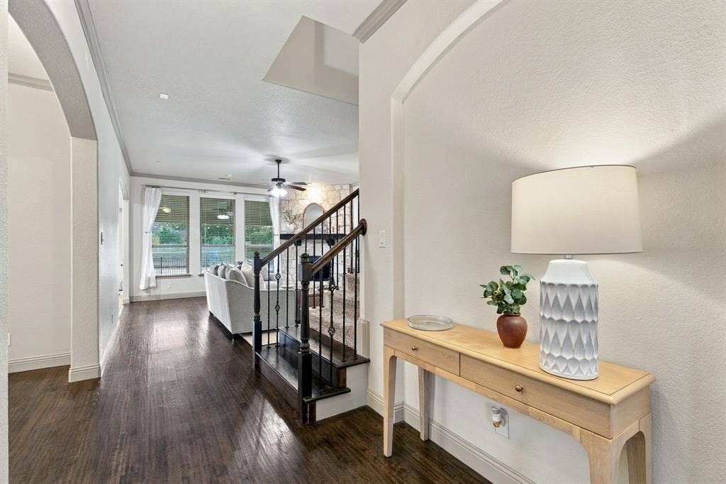 GREETED BY BEAUTIFUL WOOD FLOORS AS YOU FIRST WALK IN