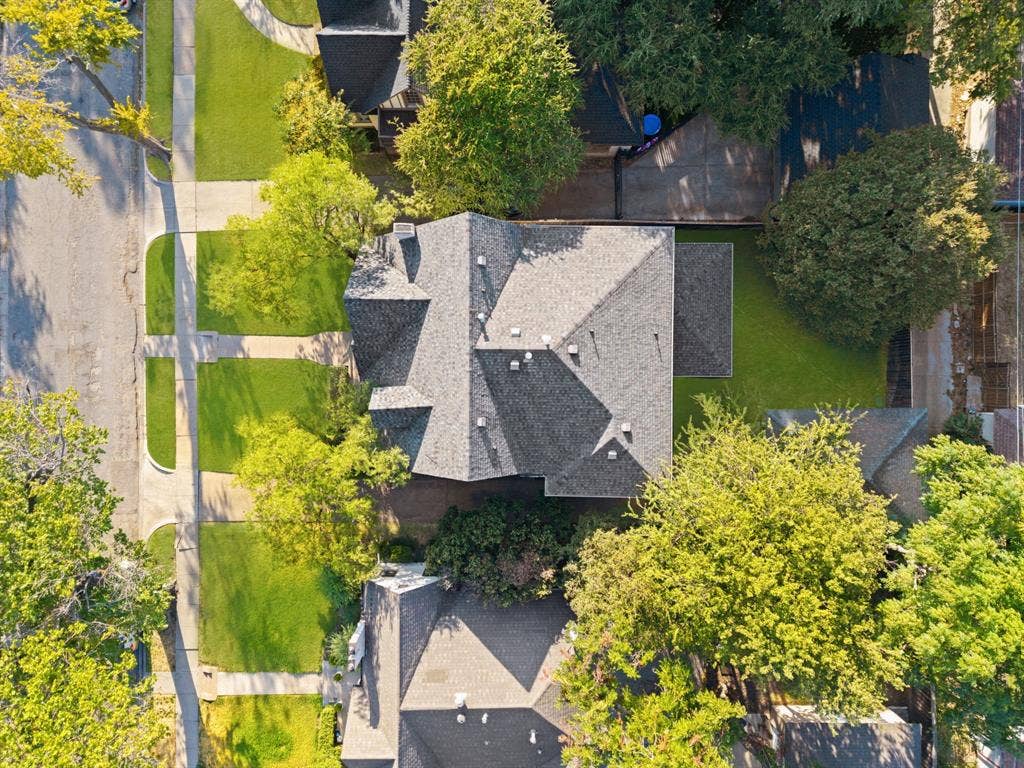 5709 Kenwood Avenue, Dallas, TX 75206 Gabled roofline with multiple pitches, mature perimeter trees, and a manicured lawn
