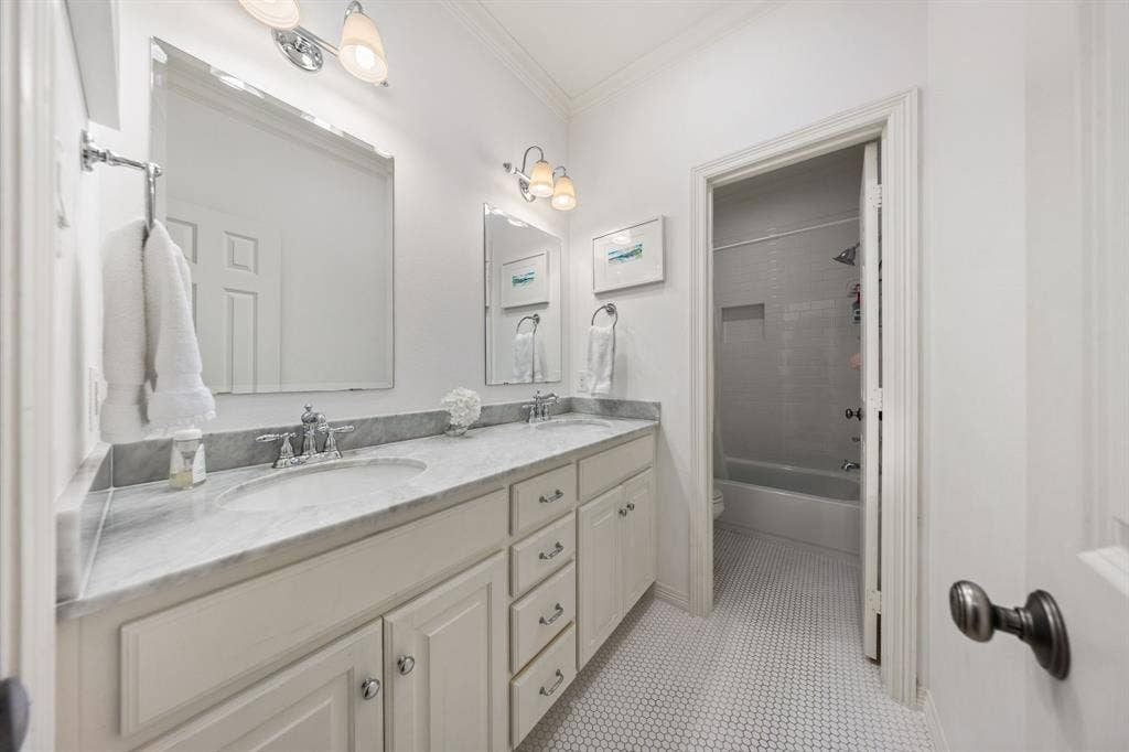 5709 Kenwood Avenue, Dallas, TX 75206 Dual vanity with undermount sinks, gray countertop, and chrome fixtures