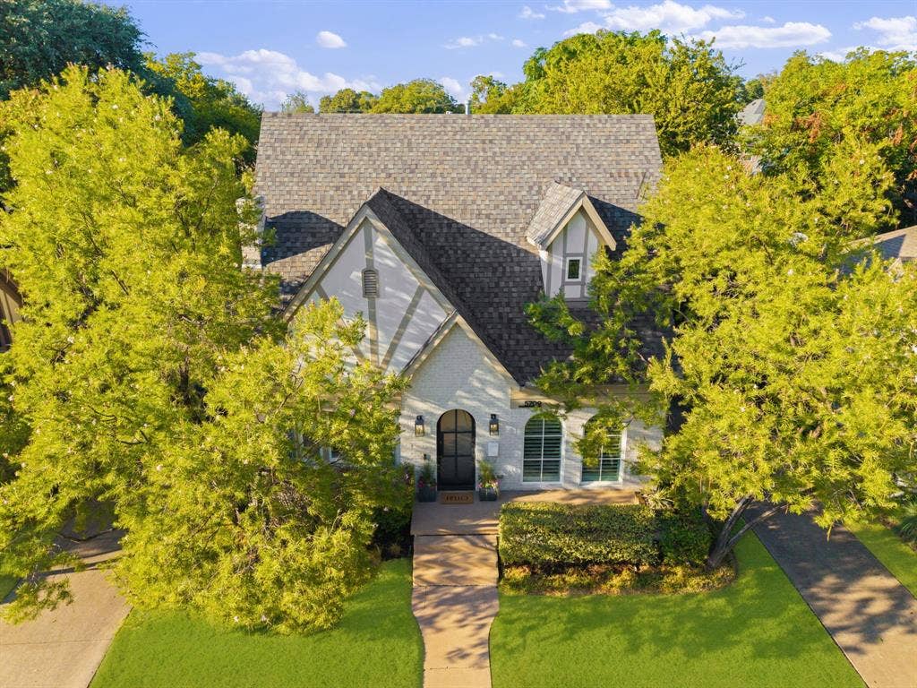5709 Kenwood Avenue, Dallas, TX 75206 Gabled roofline, dormer window, Tudor-style facade, arched entry, mature landscaping