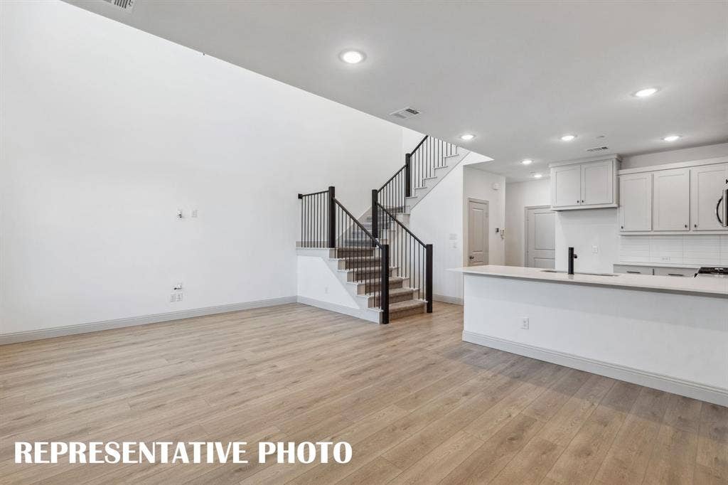 1028 Stockton Drive, Allen, TX 75013 Open metal railing on your new staircase continues the open and airy felling upstairs. REPRESENTATIVE PHOTO