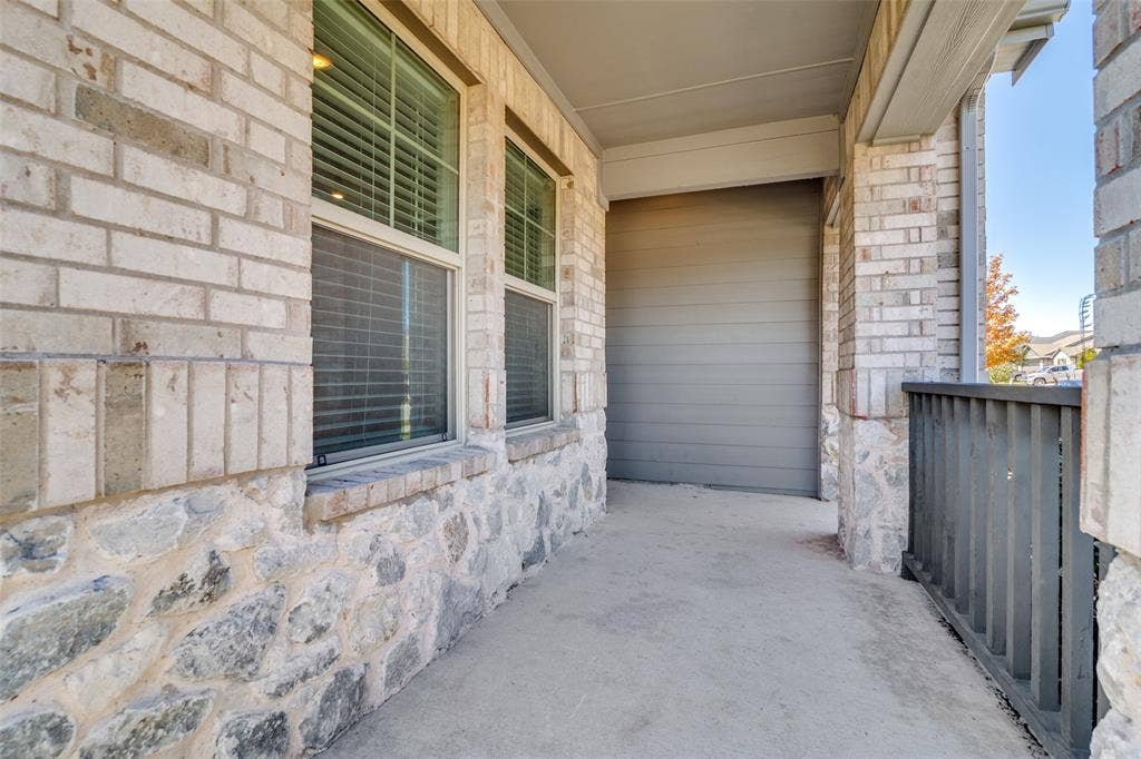 2403 Rocky Mountain Drive, Royse City, TX 75189 Brick and stone veneer exterior with a covered entry