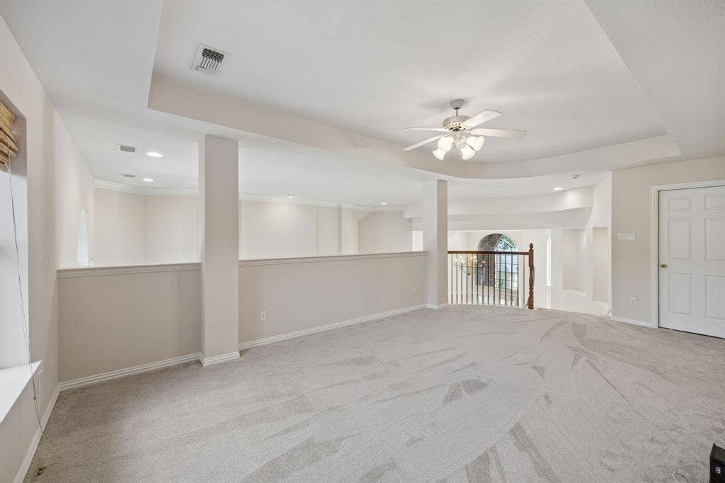1106 Hills Creek Drive, McKinney, TX 75072 View of the game room highlighting the open feel of the room. Tray ceiling adds to the spaciousness. The doorway in the background leads to floored attic space that has the potential to be converted to a media room.