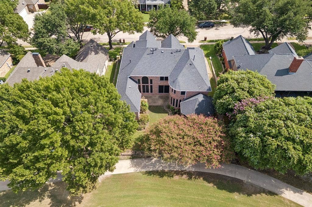 1106 Hills Creek Drive, McKinney, TX 75072 Aerial view looking toward the back of the home and highlighting the walking path behind the home.