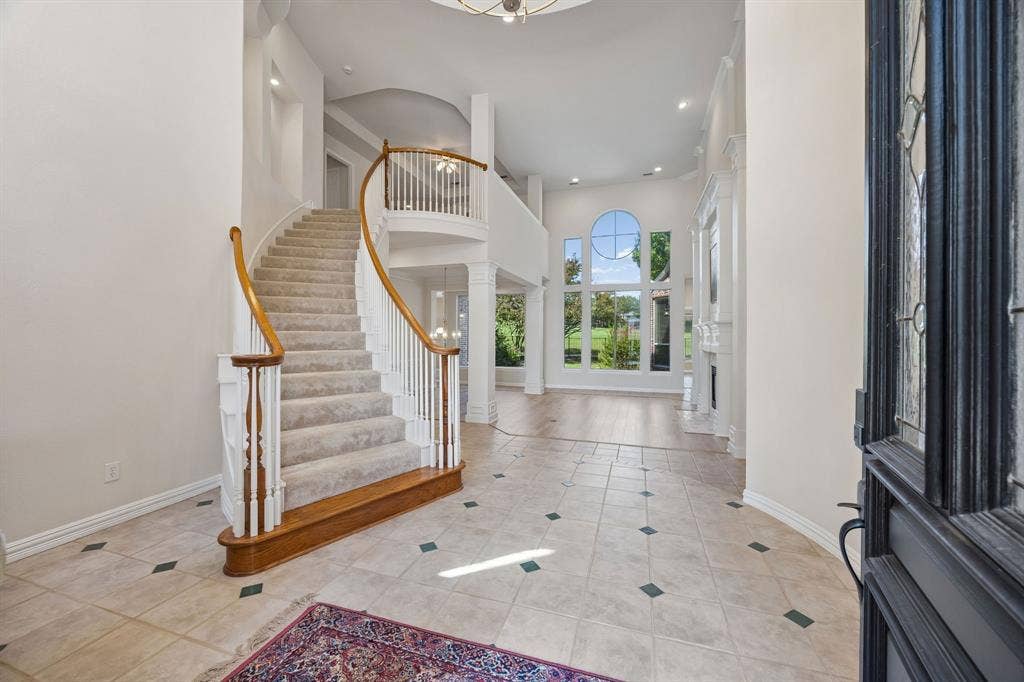 1106 Hills Creek Drive, McKinney, TX 75072 The grand entry is open to the second floor and offers a sweeping staircase to the gameroom as well as gorgeous views of the lush backyard and golf course beyond.