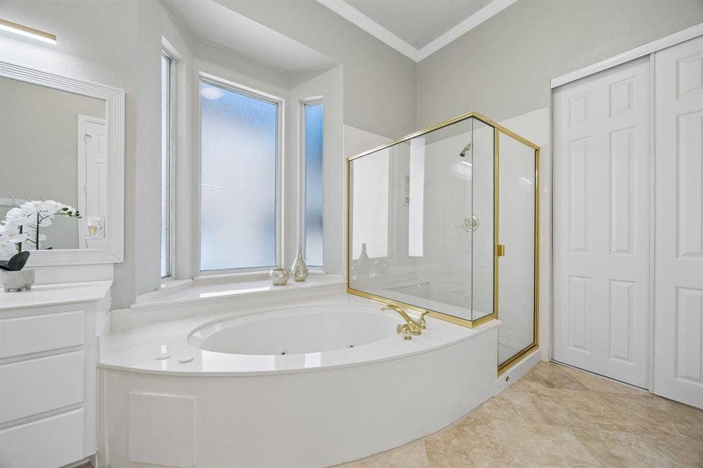 1106 Hills Creek Drive, McKinney, TX 75072 This spa-like bath offers relaxing oversized tub, separate shower and great natural light.