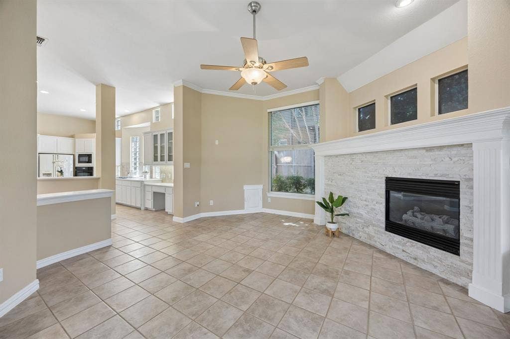 1106 Hills Creek Drive, McKinney, TX 75072 This view shows the flow between the family room, kitchen and casual dining space - perfect for relaxing at home! Yes that is a doggie door! Keep looking to see the adorable entrance from the backyard!