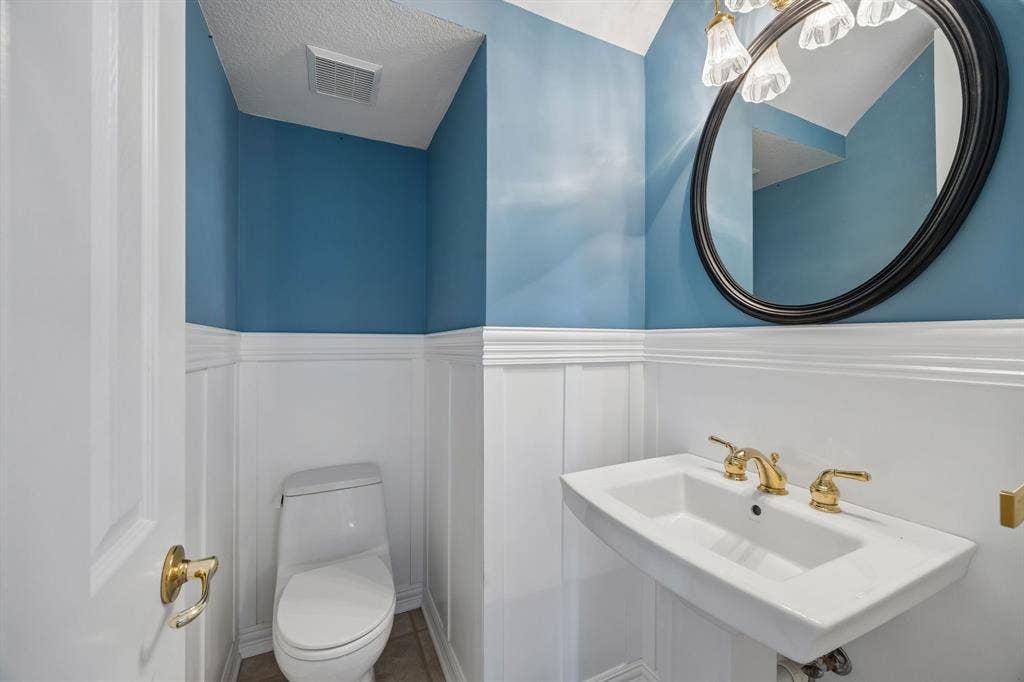 1106 Hills Creek Drive, McKinney, TX 75072 The powder room is conveniently located between the formals and the casual spaces in the home.