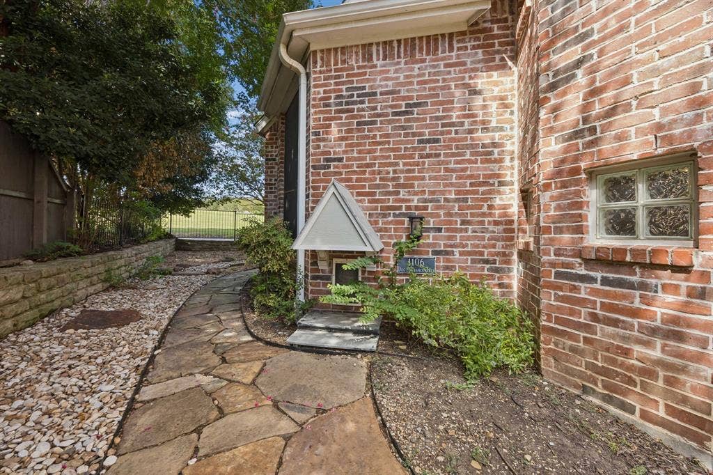 1106 Hills Creek Drive, McKinney, TX 75072 Your four-legged family members have their dedicated entrance! They can access the backyard as needed and you are able to close the doggie door from the inside.