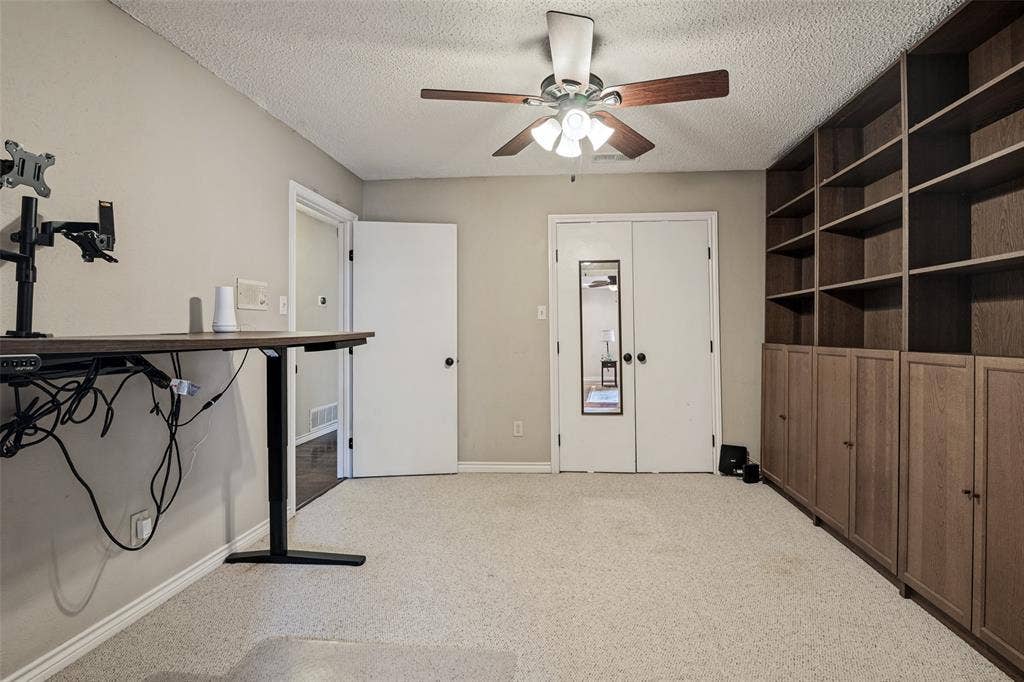 This 5th Bedroom makes a great office or playroom with shelving