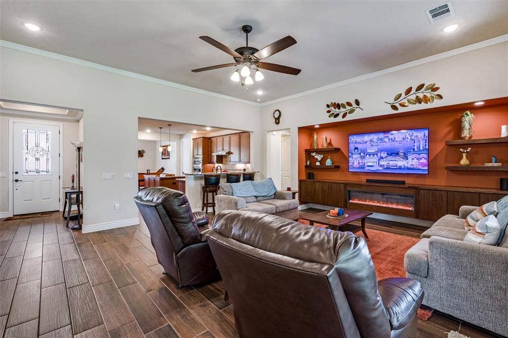 Feature wall with large built in, fireplace and open shelving