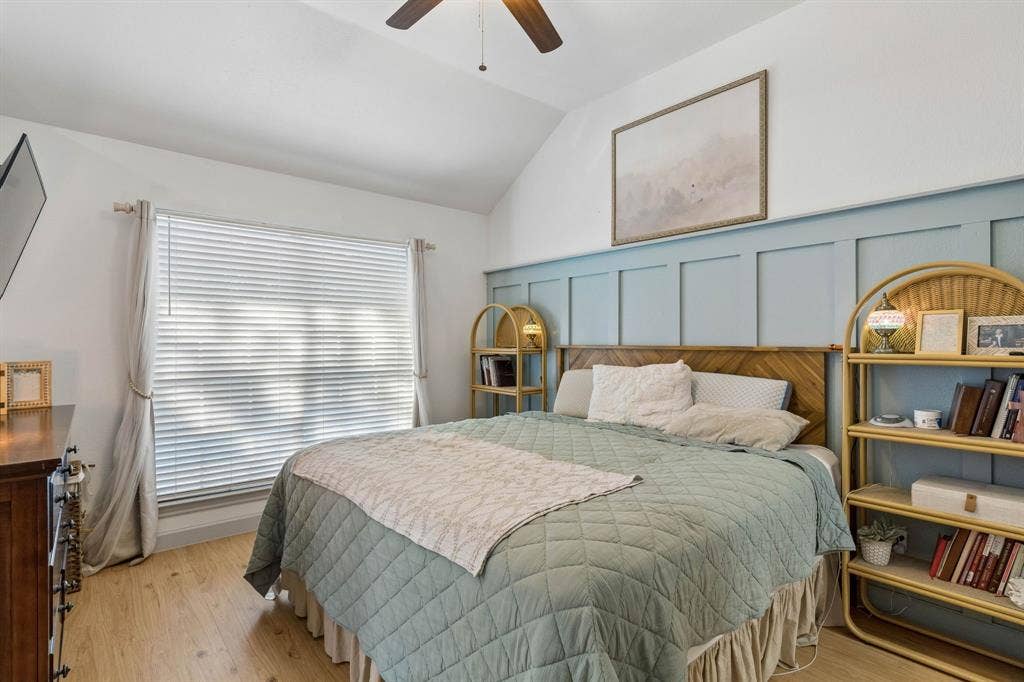 1111 Hyde Park Drive, McKinney, TX 75069 Another view of the primary bedroom displaying, the beautiful wainscotting, and the large window for lots of natural light.