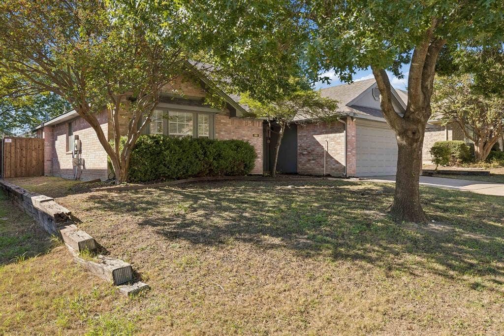 1111 Hyde Park Drive, McKinney, TX 75069 A view of the front of the house displaying the spacious front yard.