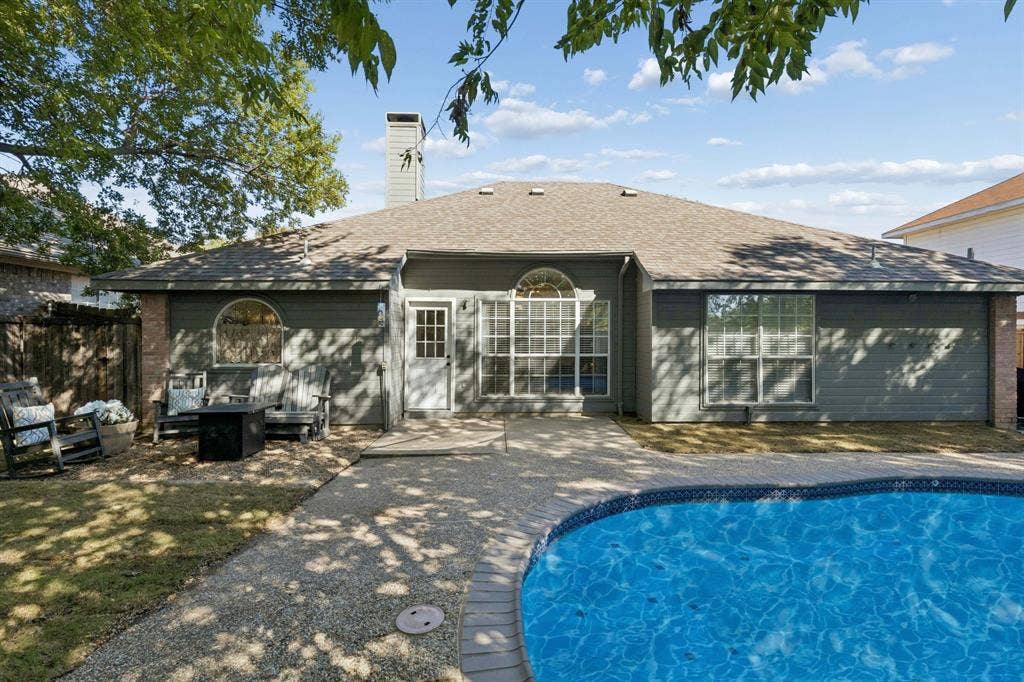 1111 Hyde Park Drive, McKinney, TX 75069 Another view of the yard displaying the patio, gravel sitting area and grassy lawn to the left.