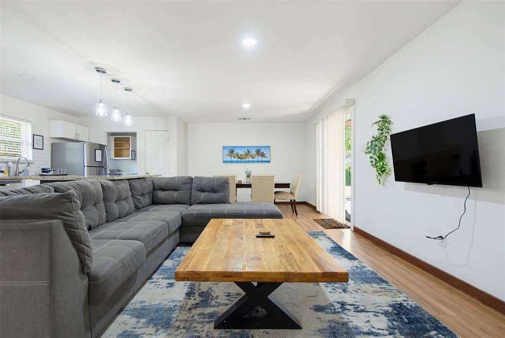 1816 Boyd Street, Dallas, TX 75224 Open-concept living area with recessed lighting and wood-finish flooring