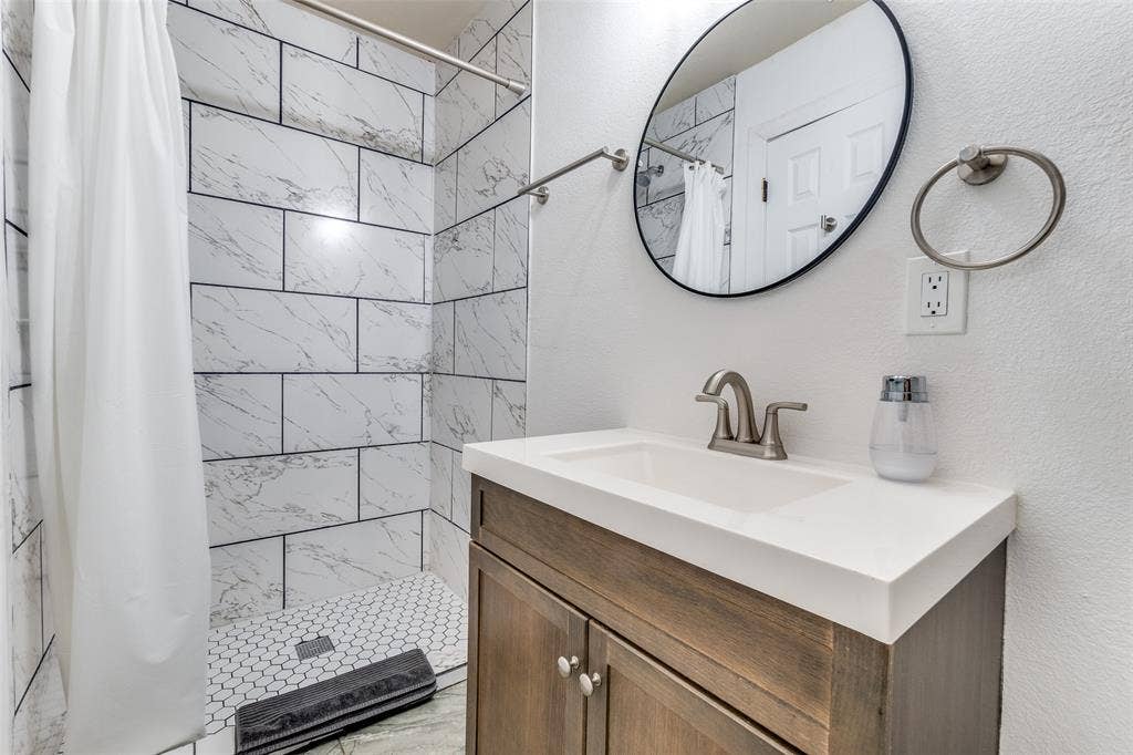 1816 Boyd Street, Dallas, TX 75224 Shower with subway tile surround and hexagonal tile floor