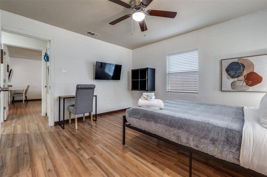 1816 Boyd Street, Dallas, TX 75224 Wood-finish flooring, ceiling fan, window with blinds, and white walls