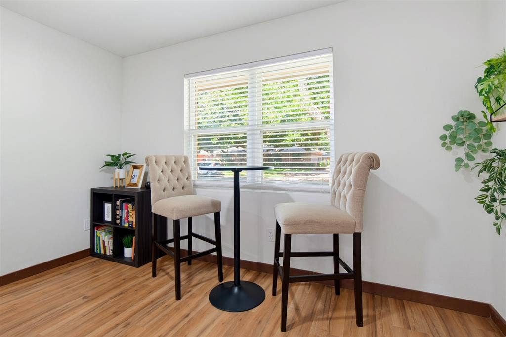 1816 Boyd Street, Dallas, TX 75224 Wood-finish flooring, white painted walls, window with horizontal blinds, built-in shelving unit