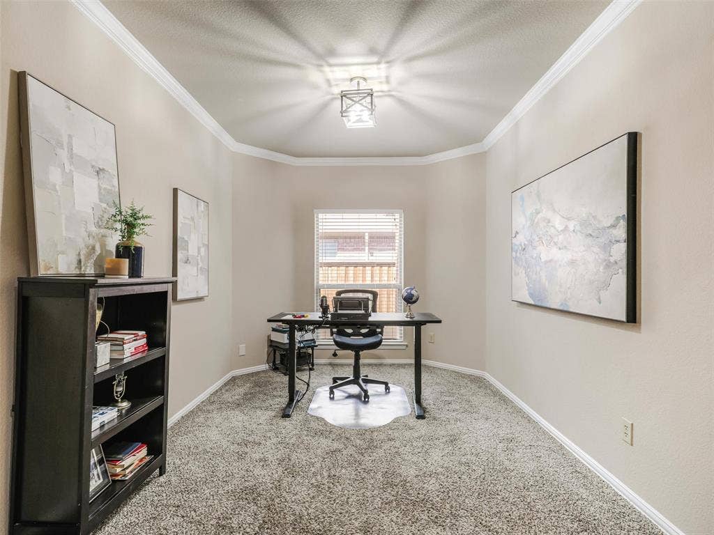 8374 Cain River Drive, Frisco, TX 75035 Currently arranged as a home office, this versatile space features crown molding, a decorative ceiling light, and a window for natural light. Space could be used as a formal dining area as well.