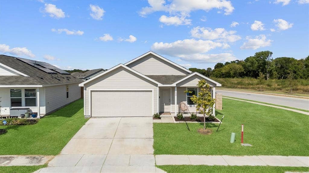 500 Waymaker Way, Princeton, TX 75407 Front of home on a corner lot across from one of the community pools.