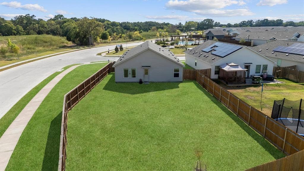 500 Waymaker Way, Princeton, TX 75407 Large grassy backyard across the street from a greenbelt.