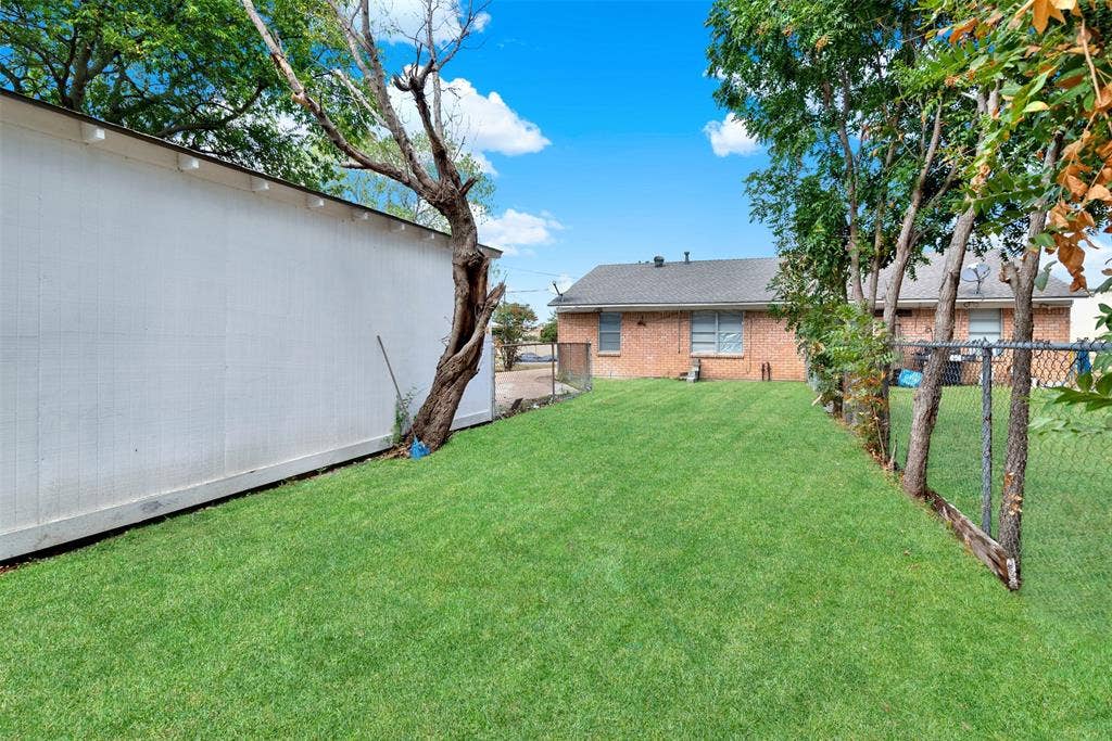 306 Hilltop Avenue, #A, Richardson, TX 75081 Note, fence down the middle of the lot provides for separate back yard.