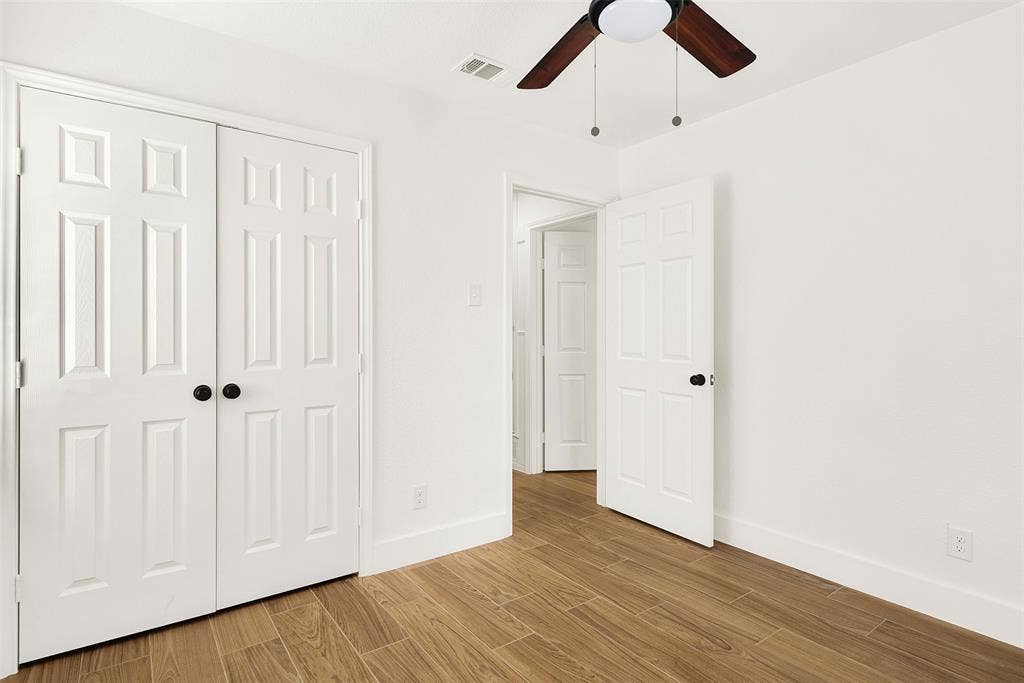 306 Hilltop Avenue, #A, Richardson, TX 75081 Master Bedroom with light wood-type flooring, and large closet
