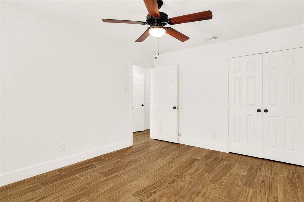 306 Hilltop Avenue, #A, Richardson, TX 75081 Unfurnished bedroom with ceiling fan, light hardwood / wood-style flooring, and a closet