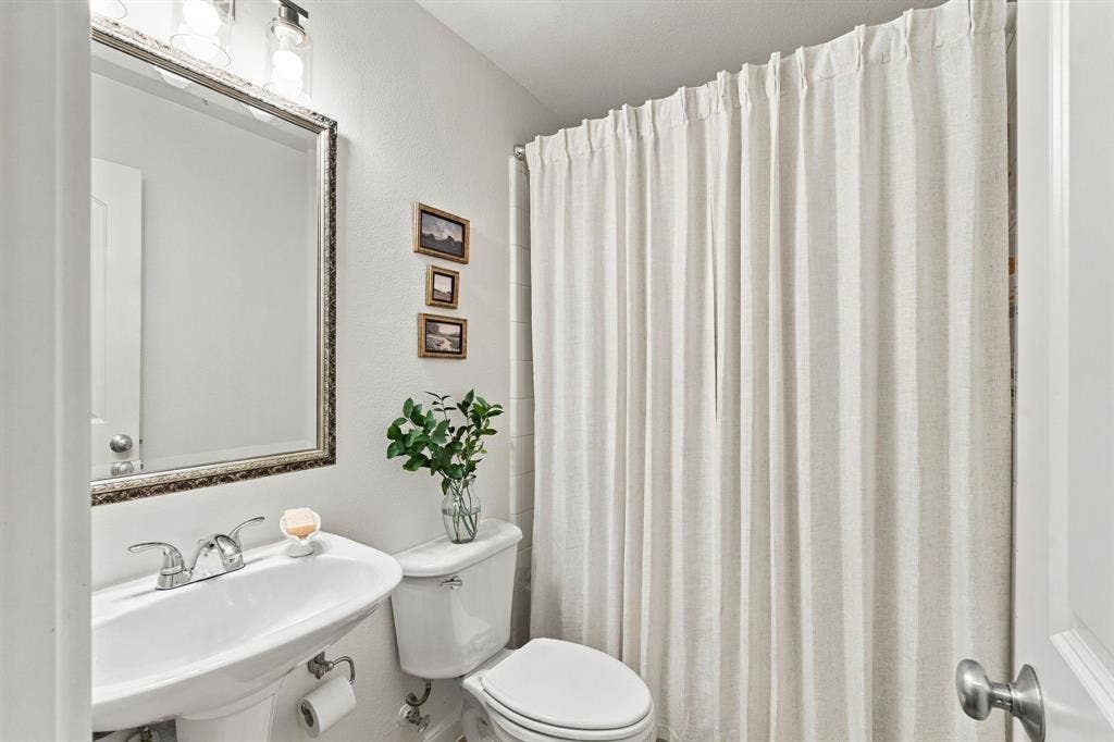 6816 Studebaker Drive, McKinney, TX 75071 One of four FULL bathrooms two down and two up