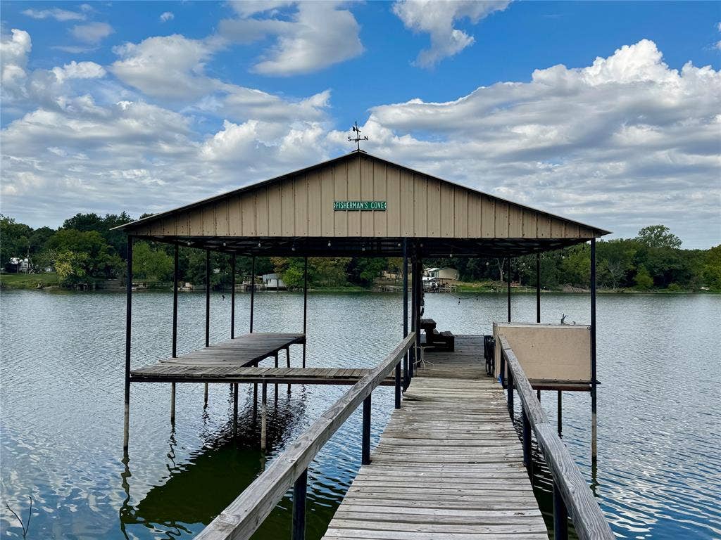 10122 Ash Cove, Wills Point, TX 75169 Covered boat dock with an extended wooden walkway and an additional platform