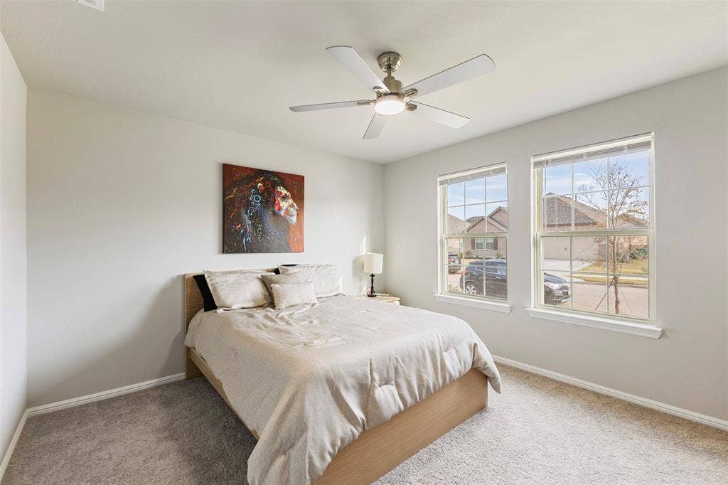 Bedroom featuring carpet and ceiling fan
