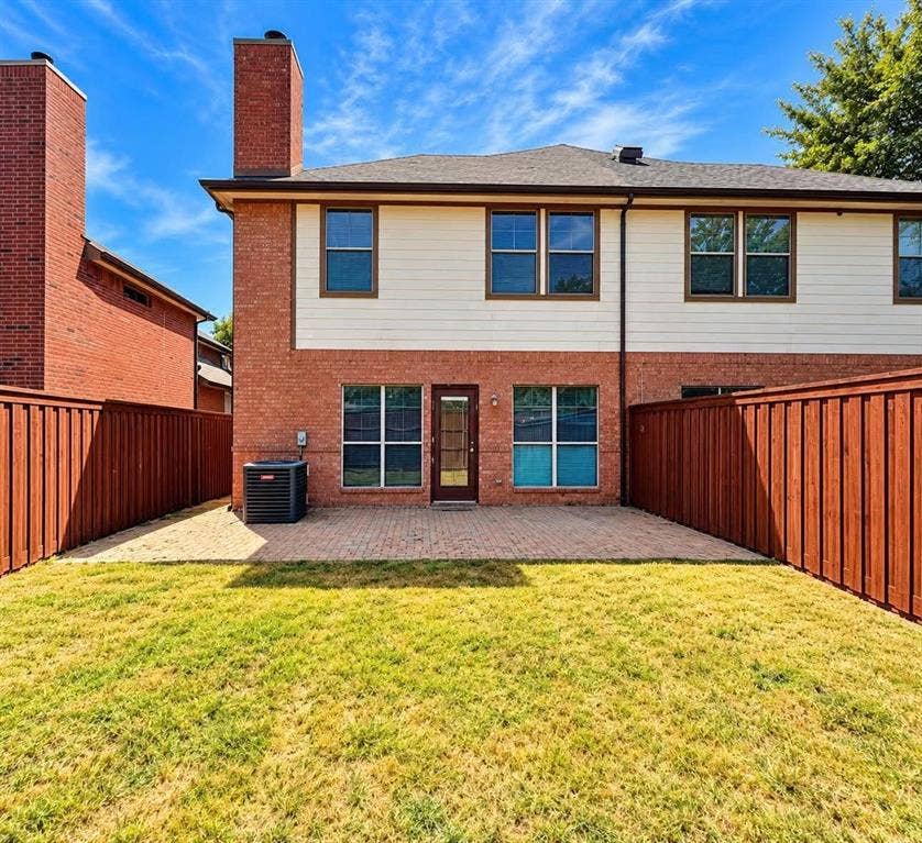 Brick exterior with a second story of horizontal siding