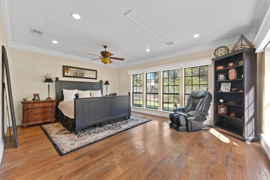1312 Chippewa Drive, Plano, TX 75093 Main-floor primary suite with abundant natural light and space for a sitting area.